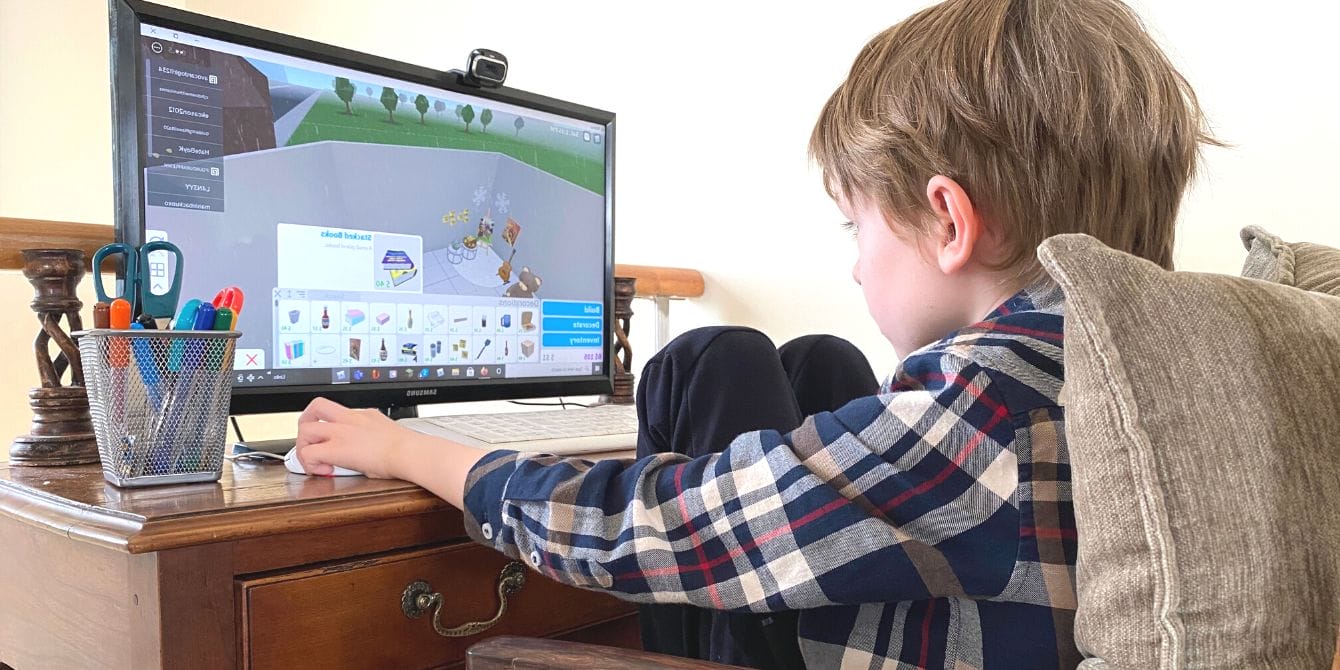 Multiple families are suing Roblox for child exploitation Boy playing Roblox