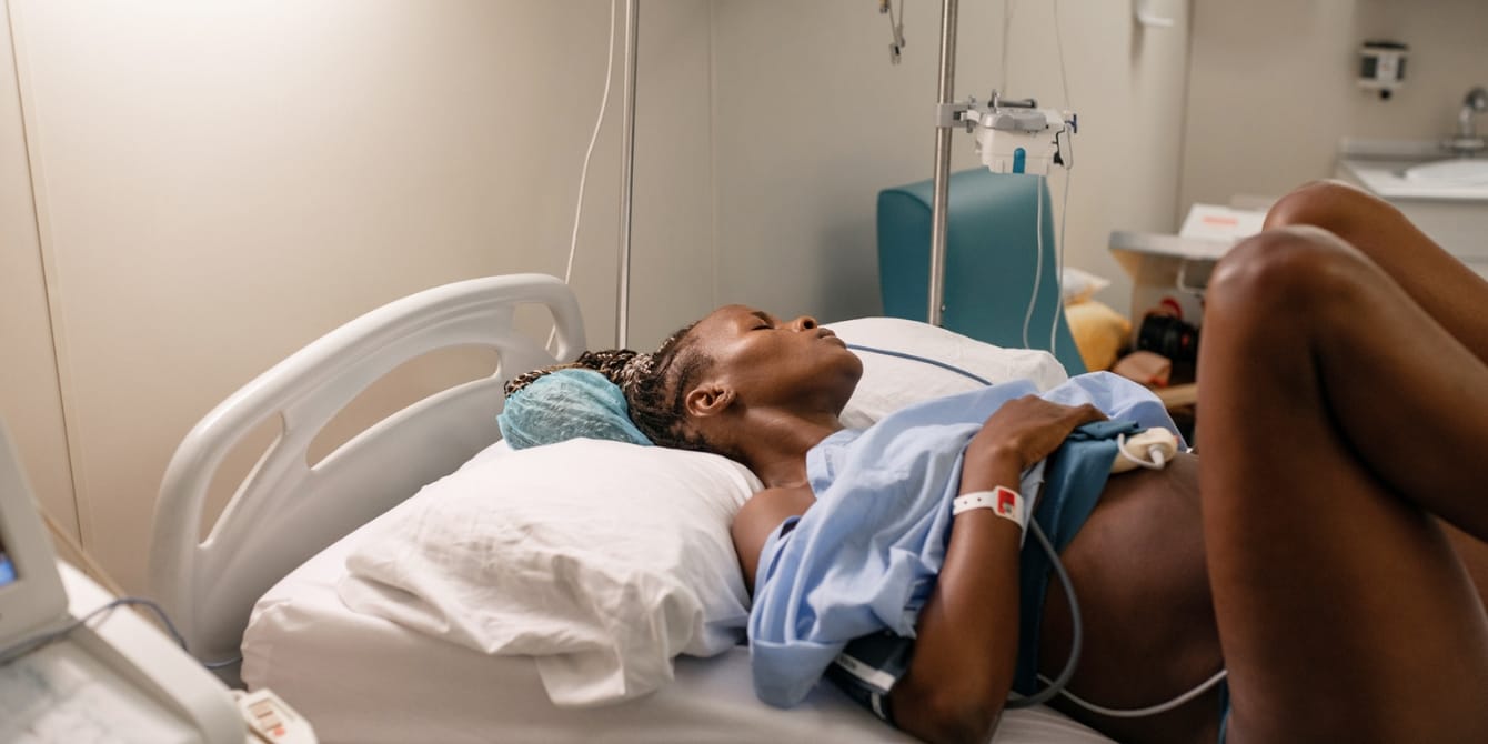 Black moms are dying in childbirth. Why aren’t we talking about the reasons behind this crisis? Black Woman With CTG Belt Giving Birth Black Maternal Mortality