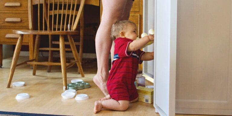 Life happens here in the midst of the mess toddler playing in cupboard - life happens here