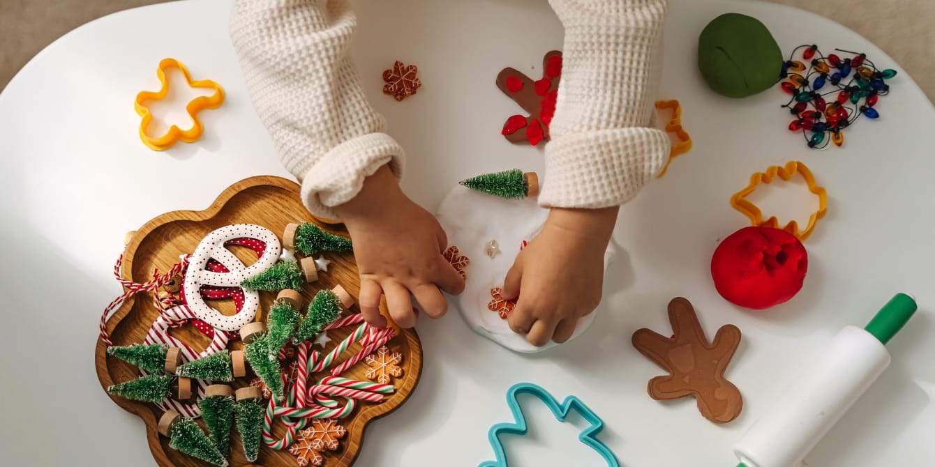 4 easy activities to do with your kids over the holiday break child hands doing Christmas craft holiday activities for kids