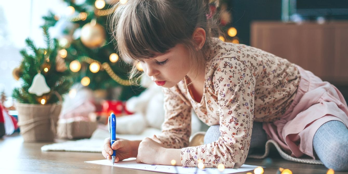 Is Santa’s ‘Naughty or Nice’ List a thing of the past? Some experts say it should be Little girl writing Christmas list to Santa