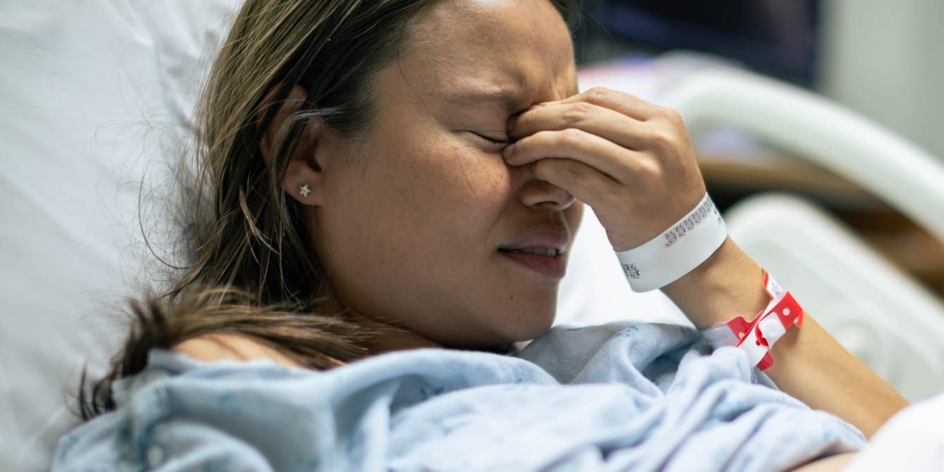 The day I lost my daughter—a story of stillbirth sad woman in hospital bed stillbirth