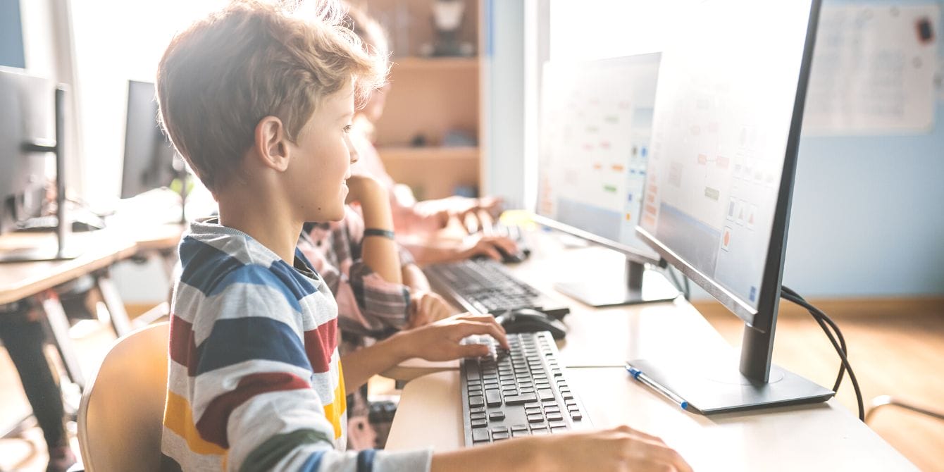 California mandates media literacy for K-12 to teach kids how to spot fake news Young student in computer science class