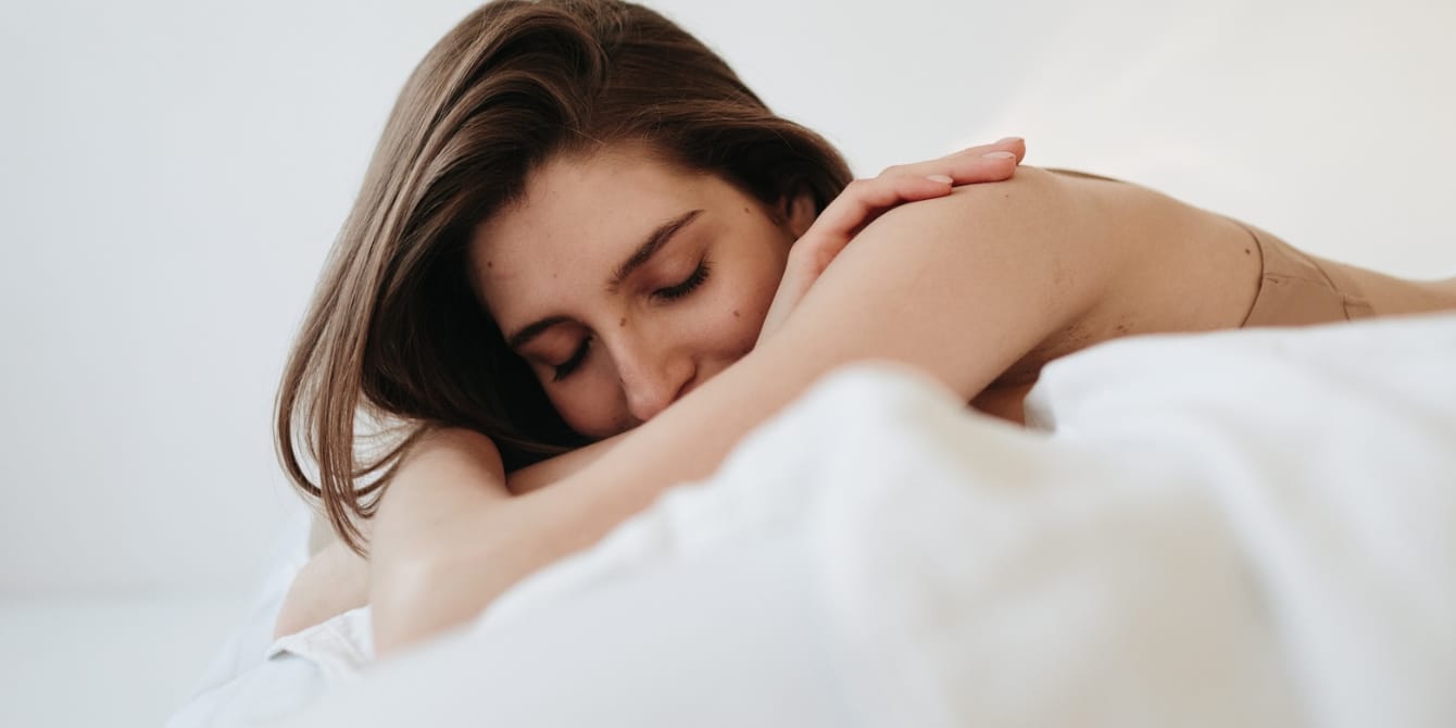 Navigating parenthood when you feel like an outlier woman laying on bed surrogacy journey
