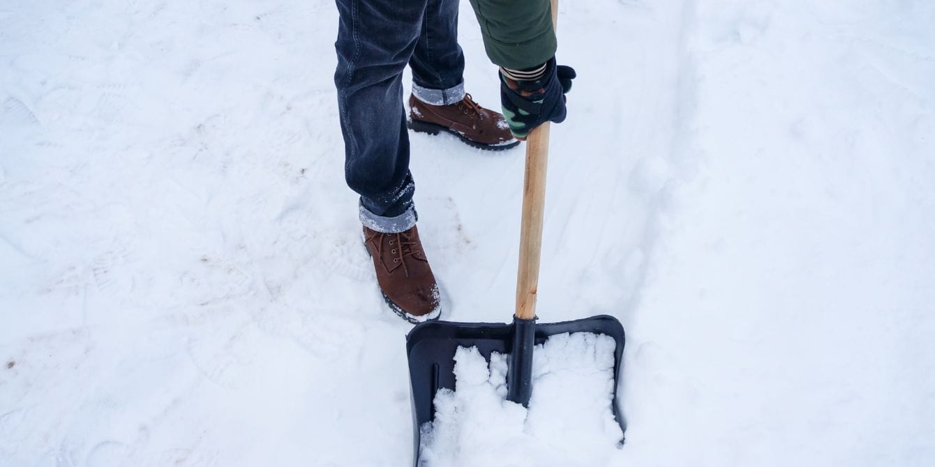 Husband’s hilarious snow message about wife’s baking marathon goes viral man shoveling snow - husband's snow message