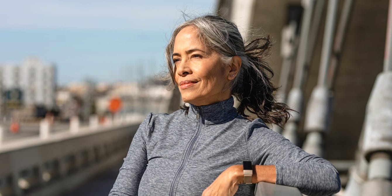 Your guide to understanding hormonal replacement therapy (HRT) for menopause middle aged woman exercising outside HRT for menopause