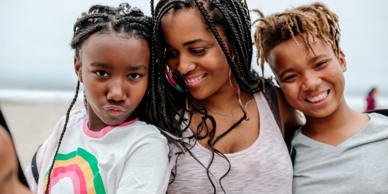 Loving unconditionally: embracing LGBTQ+ identities mom hugging her children- love your child unconditionally
