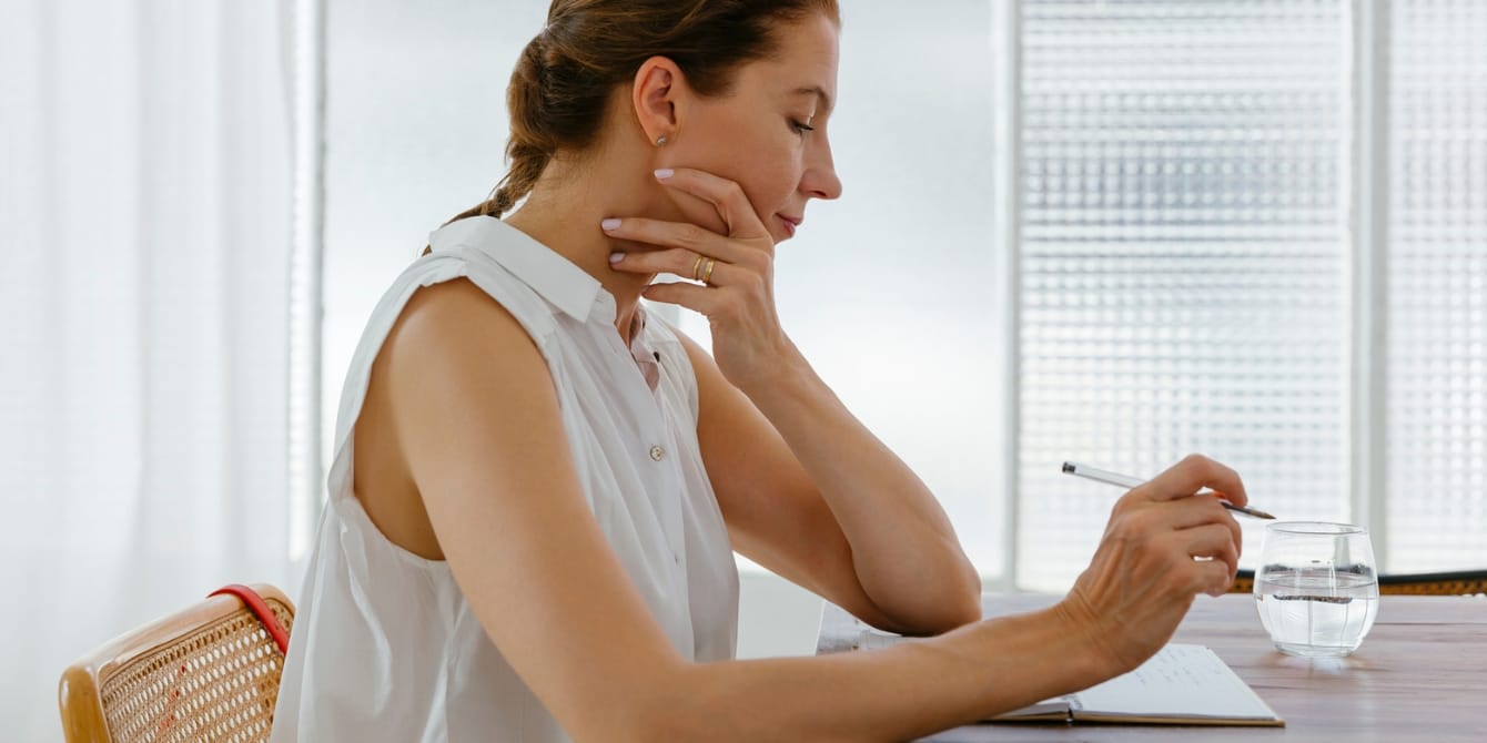 The resource we aren’t talking about: Women’s time thoughtful woman working at home women's time
