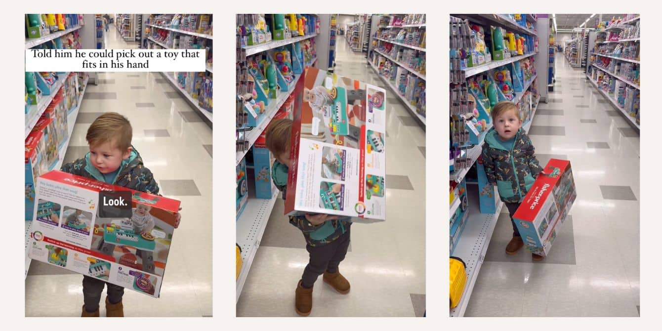 Toddler hilariously outsmarts dad to get the toys he wants in viral video Toddler holds giant toy in hand