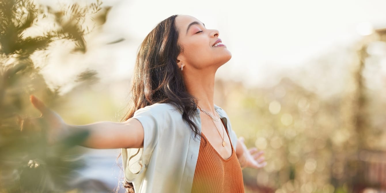 3 mindfulness practices to manage stress woman outside closing eyes peaceful - mindfulness practices