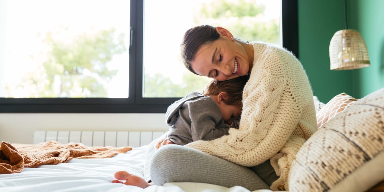 Separation anxiety: How my toddler (finally) adjusted to preschool mom hugging child- first day of preschool