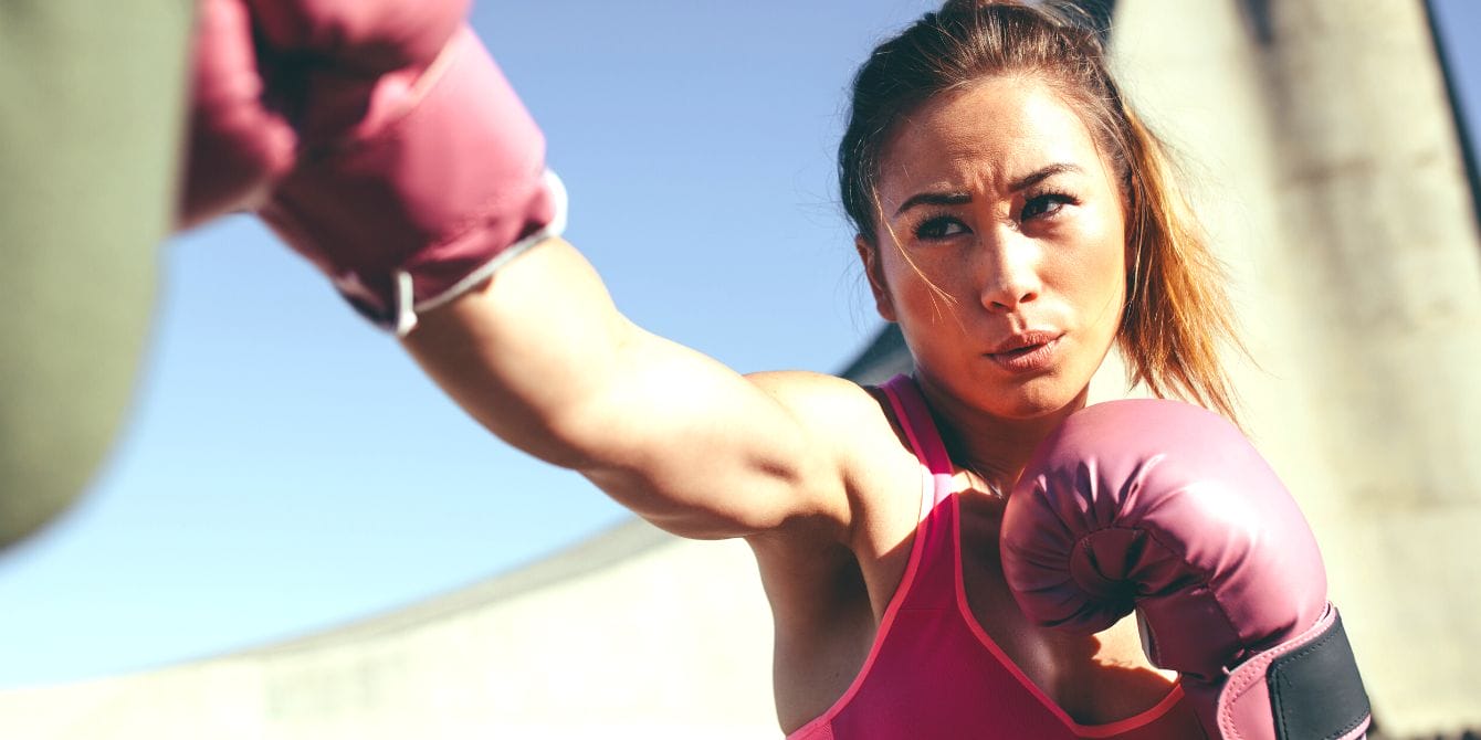 Would you try a ‘knockout workout’? woman boxing outside - knockout workouts