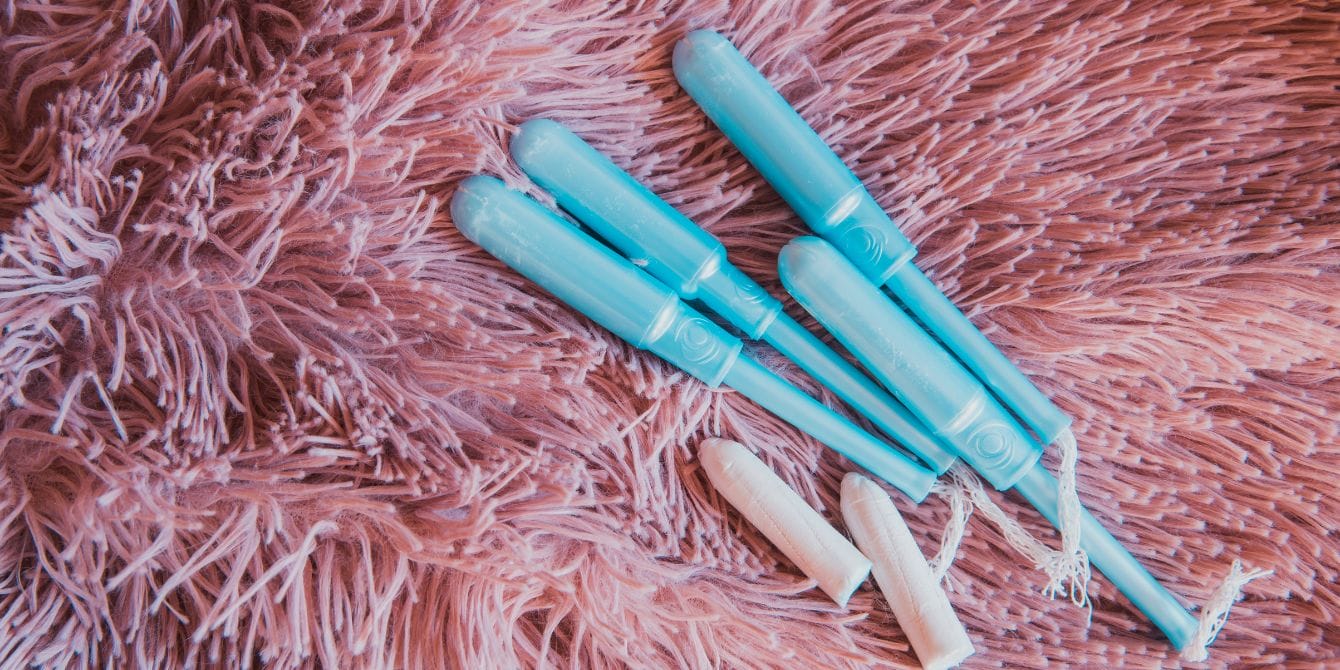 Are girls’ periods starting earlier? Study says yes blue tampon applicators and tampons on pink shag rug