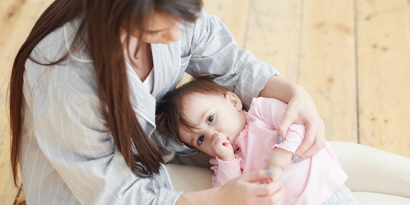 Gentle ways to wean off the pacifier or thumb-sucking, from a pediatric dentist toddler sucking their thumb on mother's lap Gentle ways to wean off the pacifier or thumb-sucking