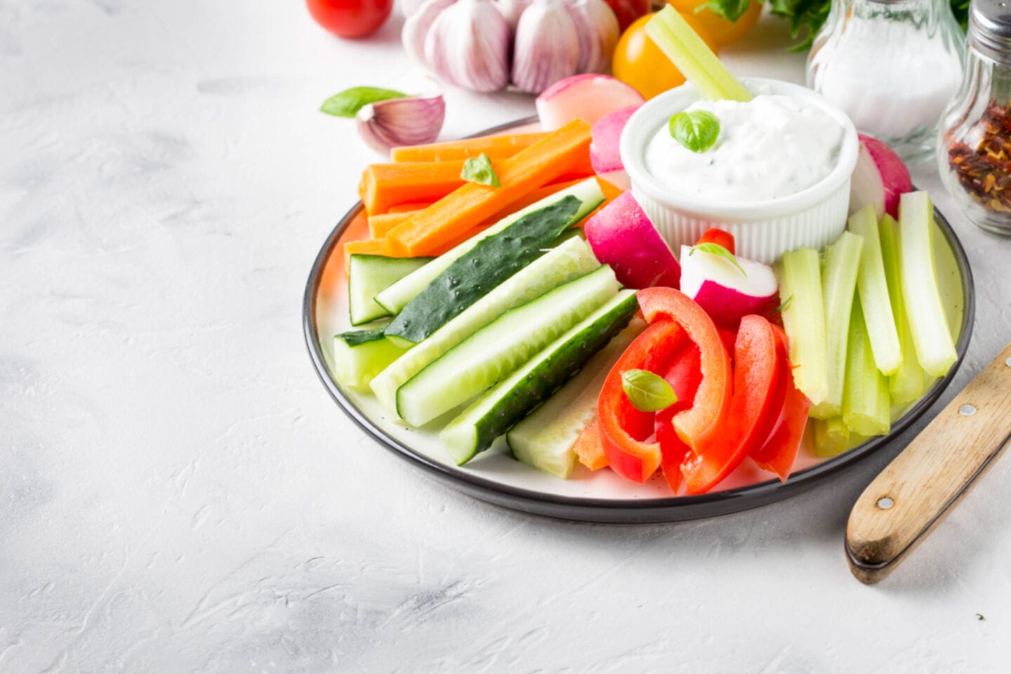 veggie sticks dip on plate - Motherly