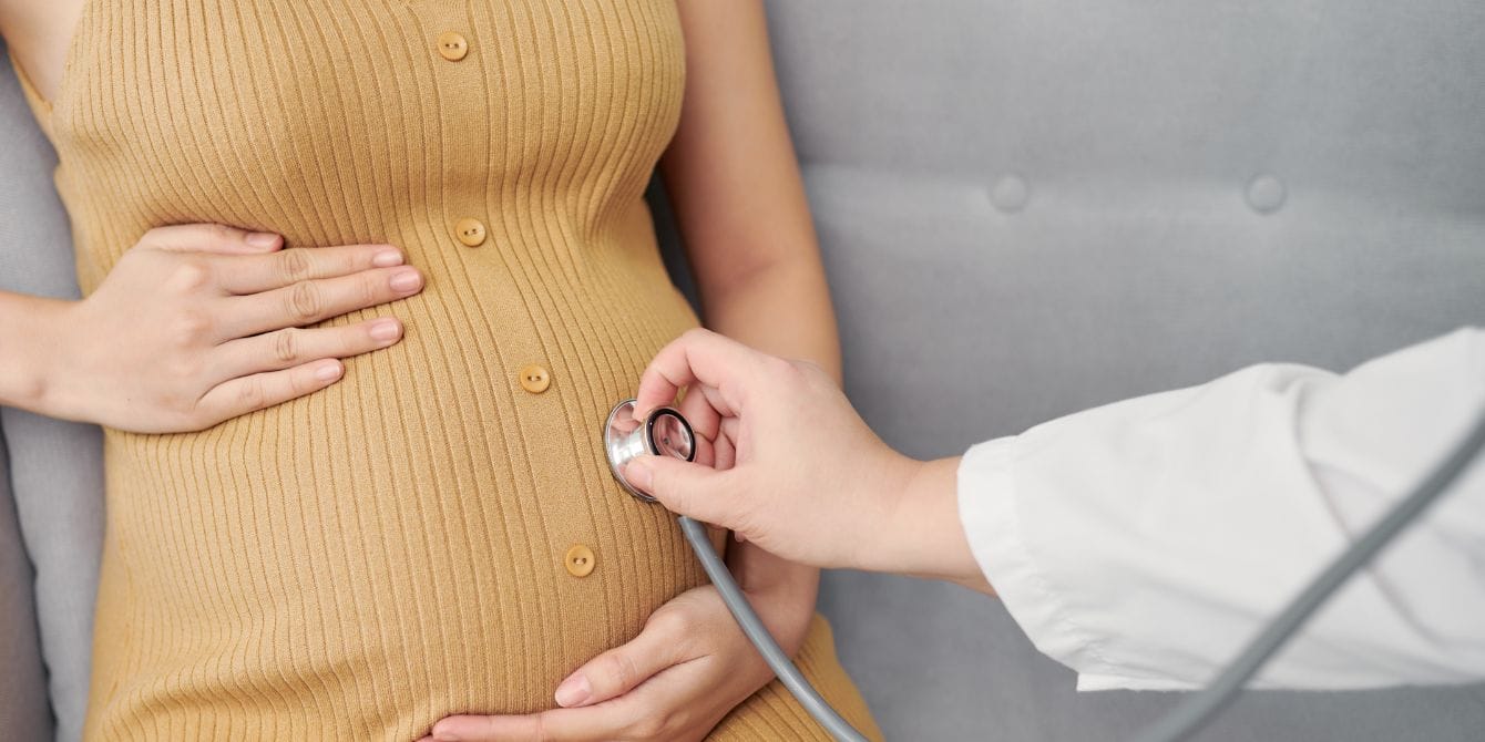 1 in 3 pregnant women are considered anemic. Why aren’t doctors taking that more seriously? pregnant woman at doctor's office - iron deficiency anemia