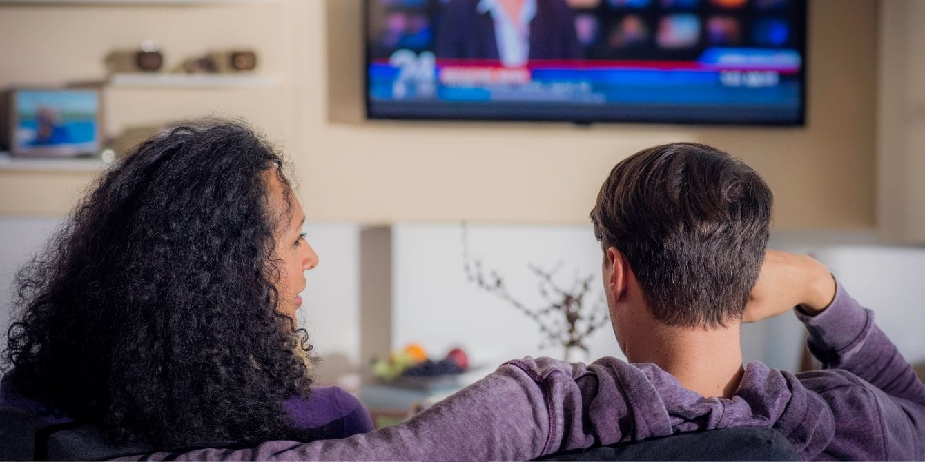 How to improve your child’s news IQ mom and son watching the news- kidnuz