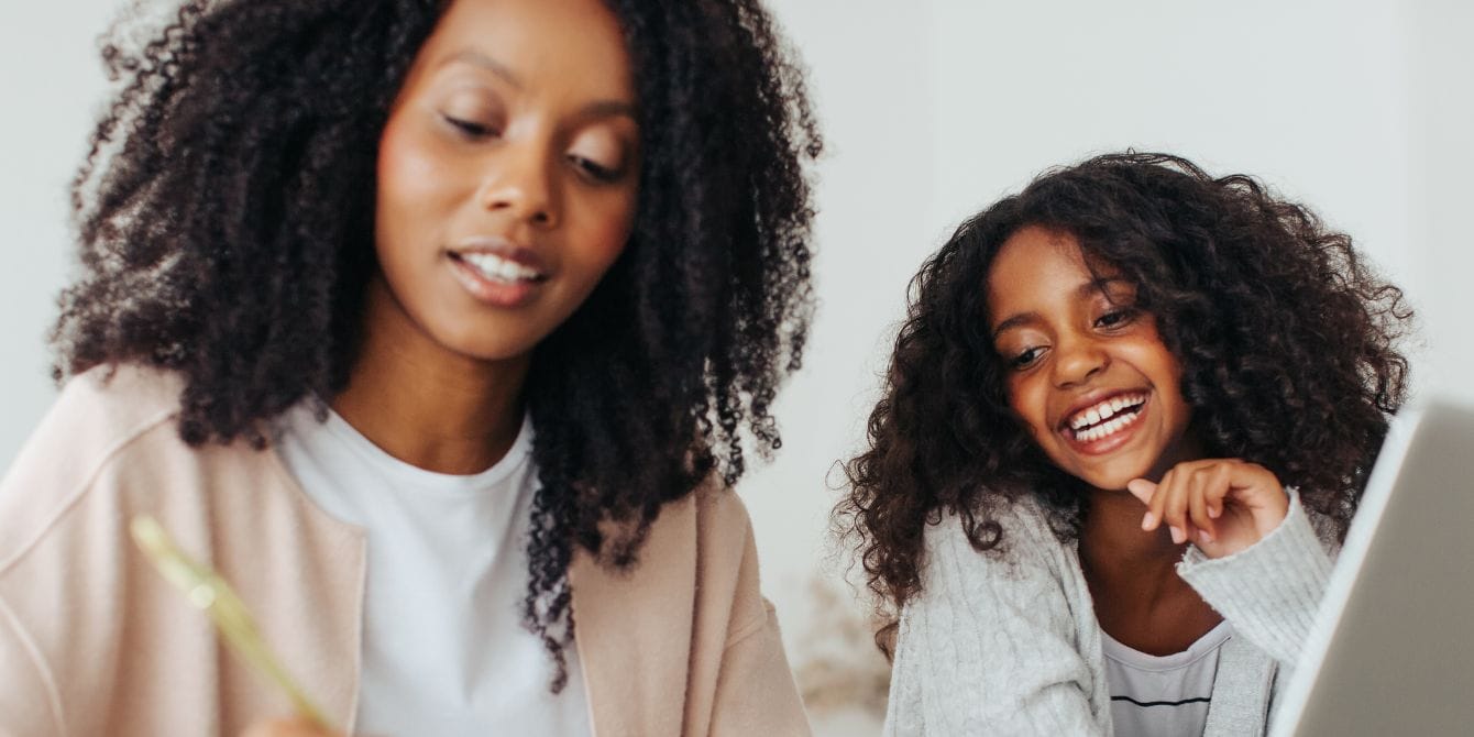 How moms and daughters can close the investing gender gap together mother and daughter talking - closing investing gender gap