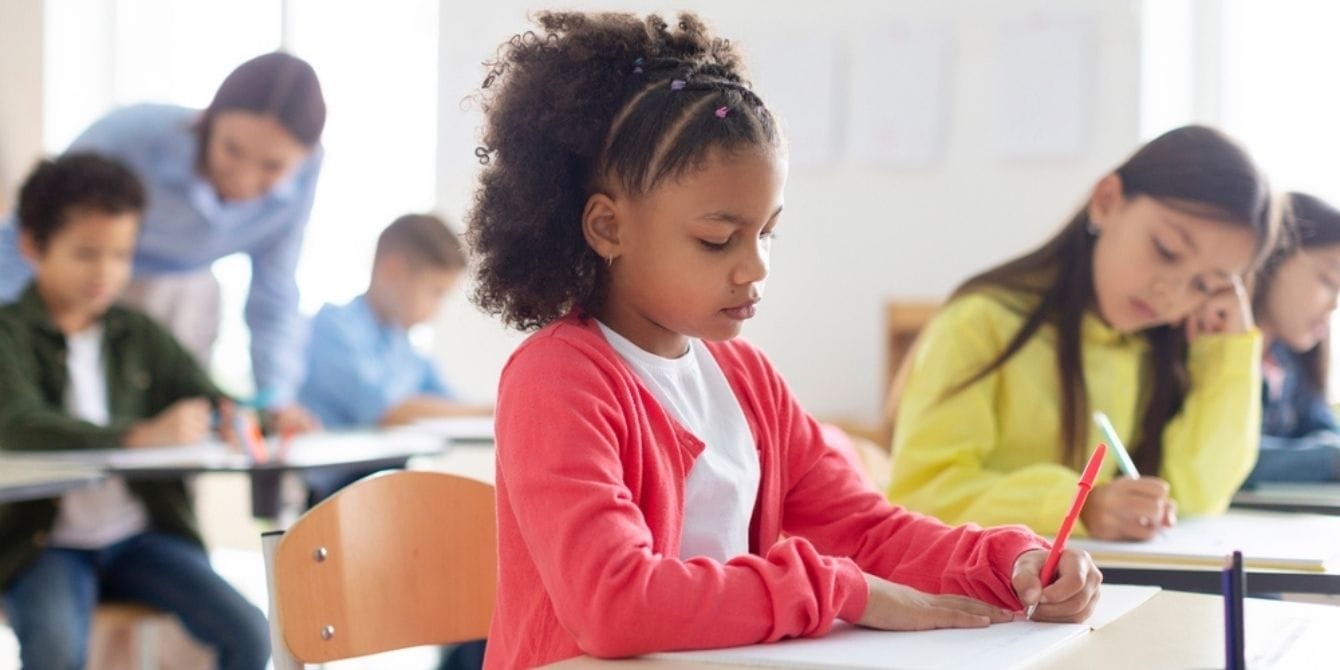 New report shows Black girls face more frequent and severe discipline in U.S. public schools Black girl finishing classwork in school
