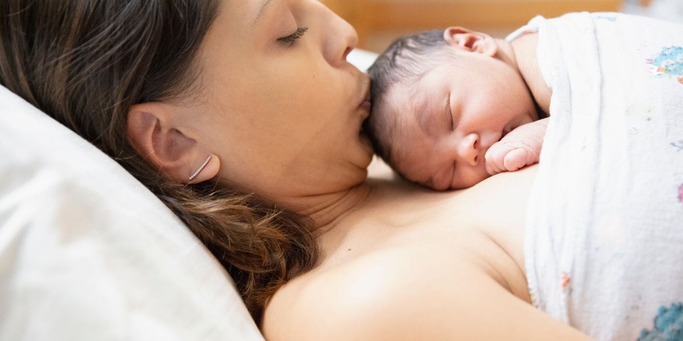 I had a postpartum hemorrhage: Why maternal health needs a champion postpartum hemorrhage - mom kissing newborn
