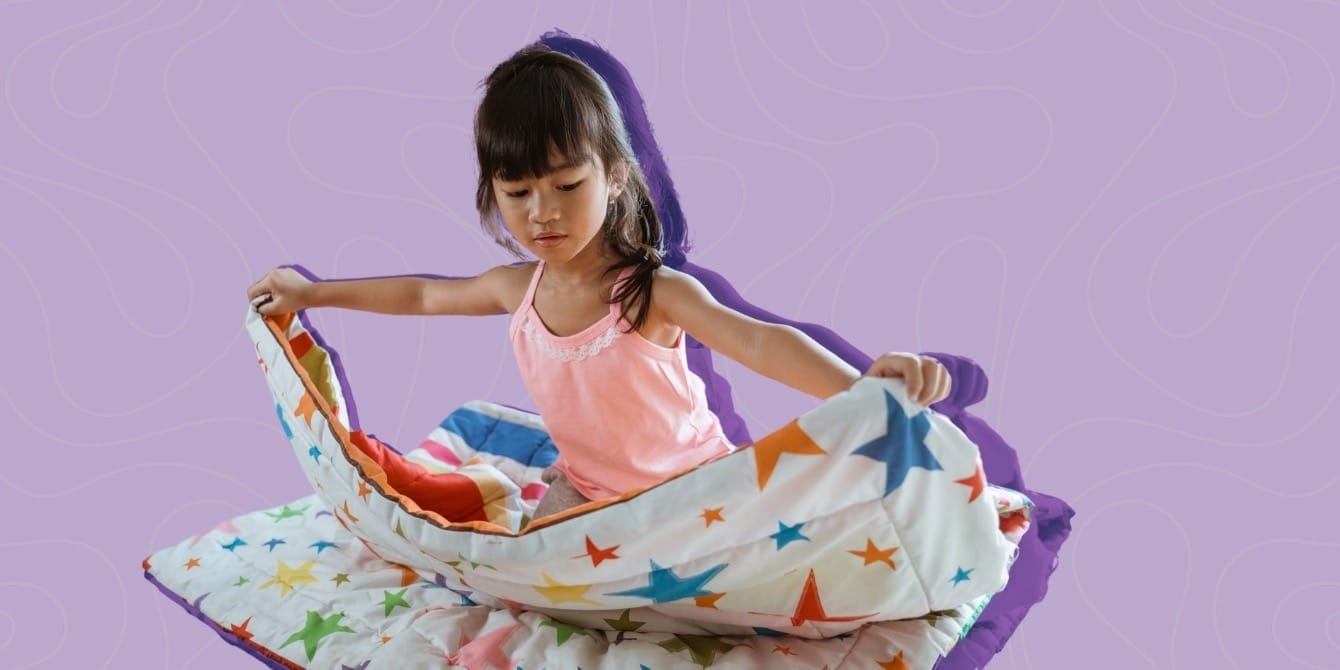 Neuroscience says: Letting your child try and fail Is the key to effective parenting A little girl folding a blanket