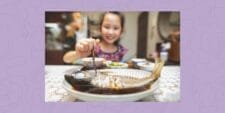 New study reveals the surprising way eating fish can boost your child’s kindness  A girl eating fish