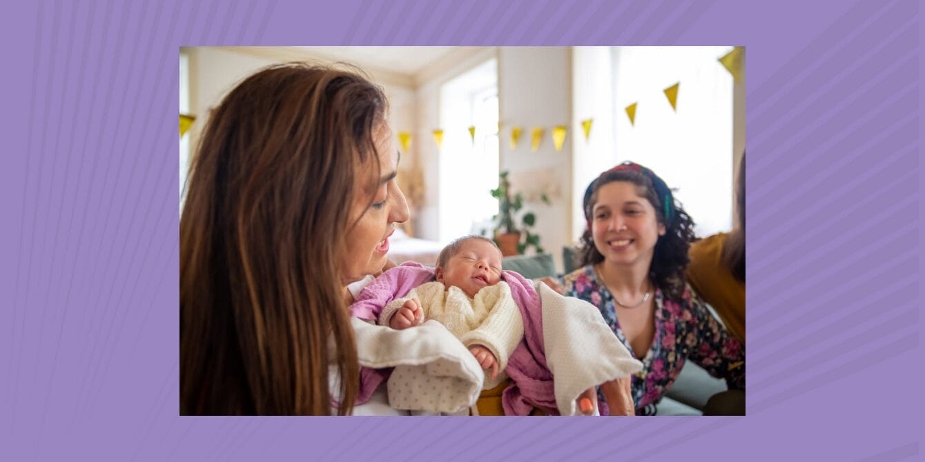 Postpartum visitors at the end, not the start: 6 boundary scripts to try Mom holding newborn baby while her best friend visits; Postpartum Visitors Boundary Scripts